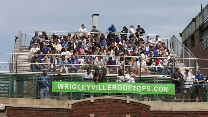 Wrigley rooftop owners file motion to halt scoreboard, sign installation
