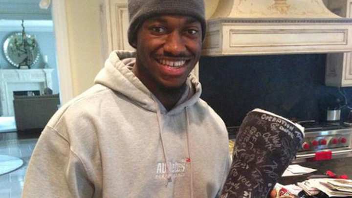 The bidding for RGIII's signed cast is now more than $1,000