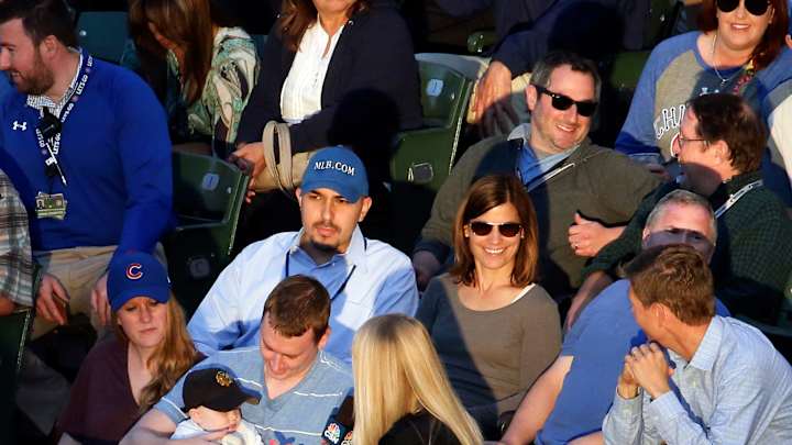 Fan makes great catch over tarp while holding baby Fan makes great catch over tarp while holding baby