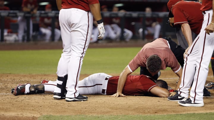 Arizona's Peralta out after being hit in head by pitch