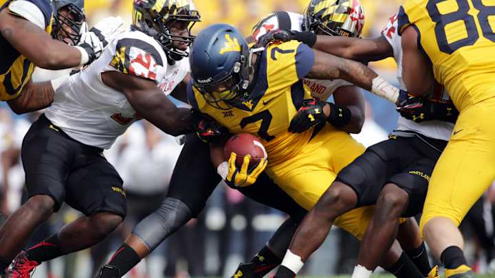 West Virginia topples Maryland 45-6 West Virginia topples Maryland 45-6