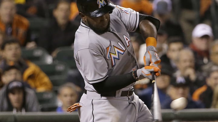Haren uses bat, arm to lead Marlins past Giants 7-2