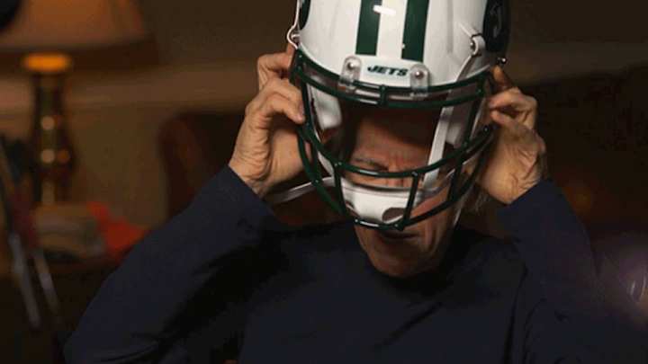 Larry David has a very hard time putting on a Jets helmet