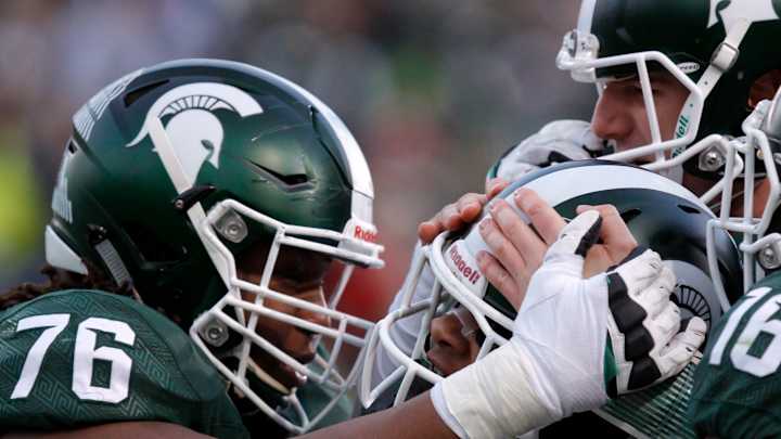 Michigan State takes division with 55-16 rout of Penn State