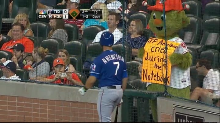 Astros' mascot took a shot from Rangers' J.P. Arencibia, but fired back with some clever signs