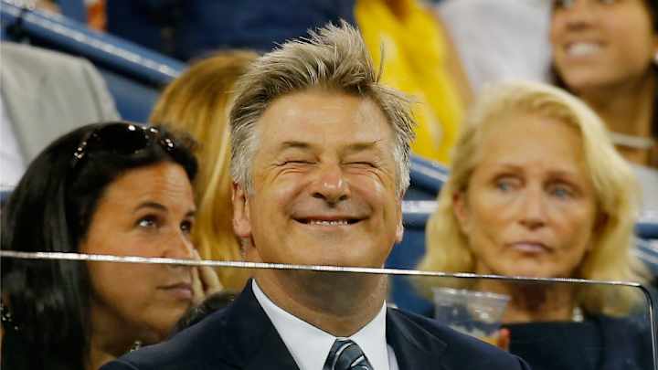 Alec Baldwin easily snags a tennis ball in the crowd during U.S. Open match