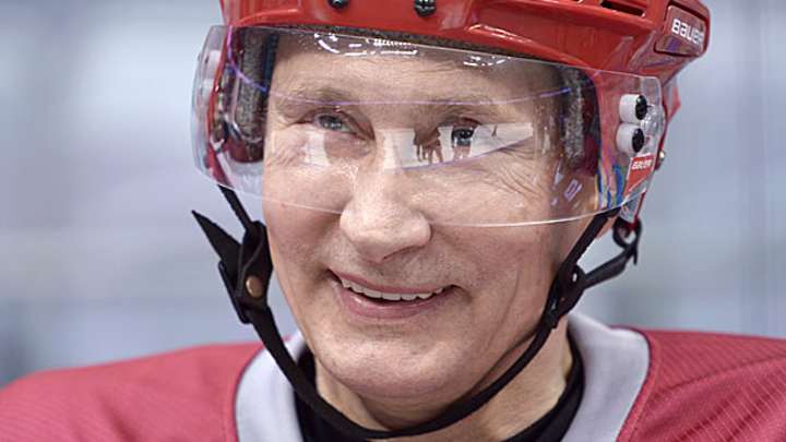 Must-see video: Russian president has trouble Putin on his hockey helmet