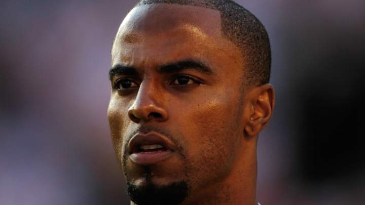 Former NFL safety Darren Sharper arrested on suspicion of rape, faces multiple investigations
