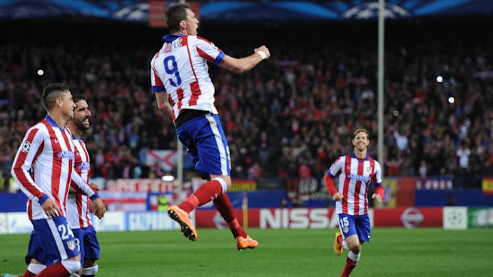 Mandzukic stars for Atlético; Sanchez and Sanogo propel Arsenal to win