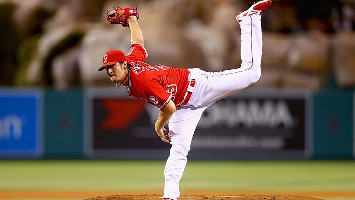 C.J. Wilson's performance, A's implosion help Angels clinch AL West