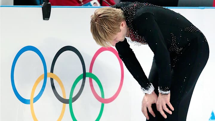 Back injury forces Russia's Plushenko from men's figure skating Back injury forces Russia's Plushenko from men's figure skating
