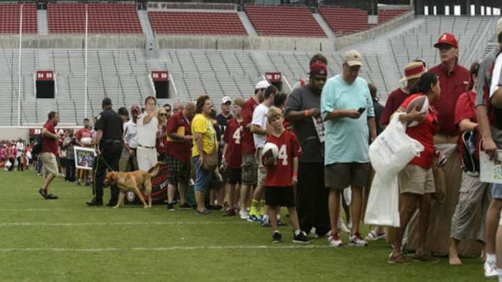 Alabama fans are willing to do whatever it take to get Nick Saban's autograph Alabama fans are willing to do whatever it take to get Nick Saban's autograph