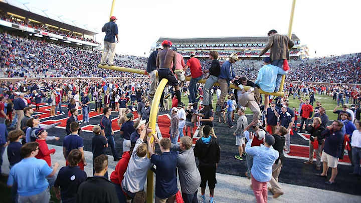 Ole Miss fans celebrate Alabama upset by carrying goal posts Ole Miss fans celebrate Alabama upset by carrying goal posts