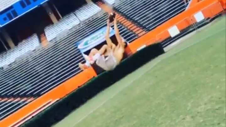 Florida Gators QB Will Grier catches a football mid-backflip