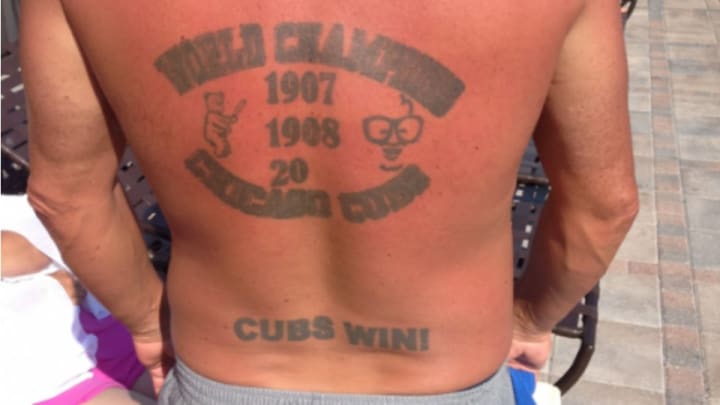 Cubs fan gets "World Champions" tattoo with last 2 digits blank Cubs fan gets "World Champions" tattoo with last 2 digits blank