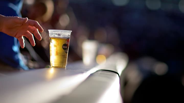 Home run ball hit into the stands takes out a fan's beer