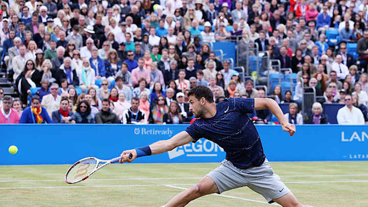 Grigor Dimitrov saves match point to win Queen's Club final