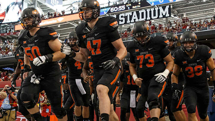 Fountain on Oklahoma State's campus dyed maroon
