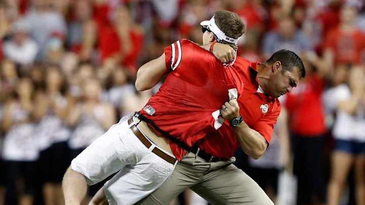 Ohio State strength coach tackles student on field Ohio State strength coach tackles student on field