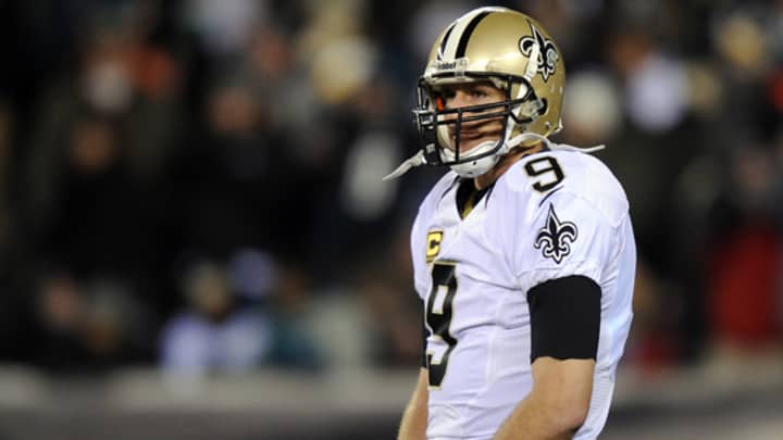 Drew Brees throws two interceptions, ties postseason high in uneven first half