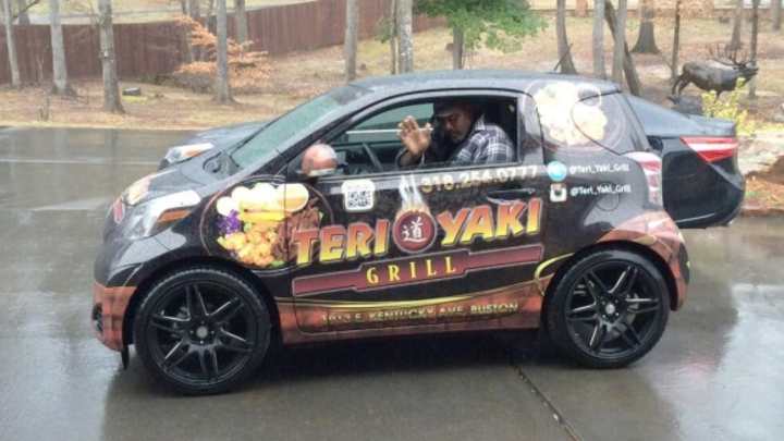 Utah Jazz legend Karl Malone struggles to fit inside smart car