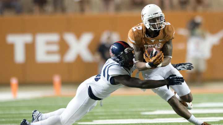 Two Texas players charged with sexual assault, suspended from team