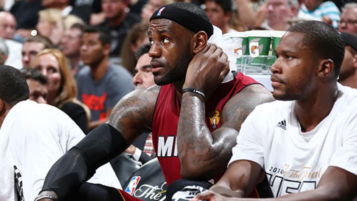 Heat's LeBron James (cramps) forced out during crunch time of Finals Game 1 Heat's LeBron James (cramps) forced out during crunch time of Finals Game 1