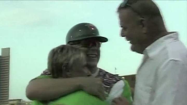 Returning soldier surprises family on field disguised as a baseball player Returning soldier surprises family on field disguised as a baseball player