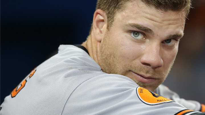 Orioles' Chris Davis helped flip an overturned truck on the highway