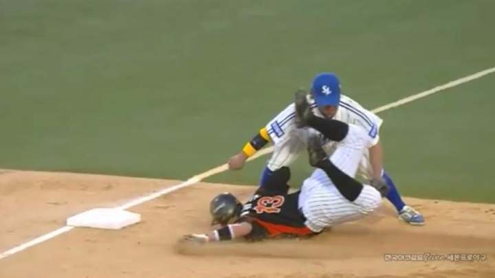 Korean baseball player eats it with face-first slide