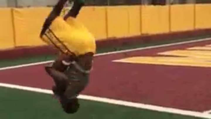 Minnesota wide receiver catches two balls while doing a backflip