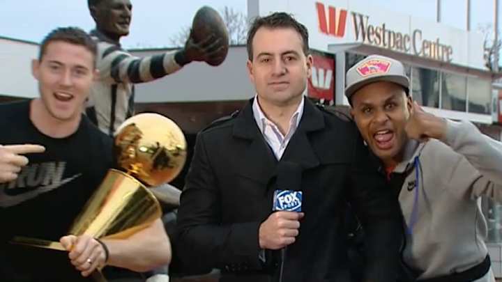 The Spurs videobomb Australian reporter with championship trophy and he does not like it