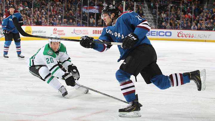 Avalanche's Nathan MacKinnon catches ricocheting puck with stick Avalanche's Nathan MacKinnon catches ricocheting puck with stick