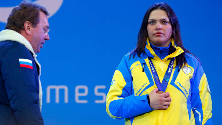 Covering medals, Ukrainians stage silent protest