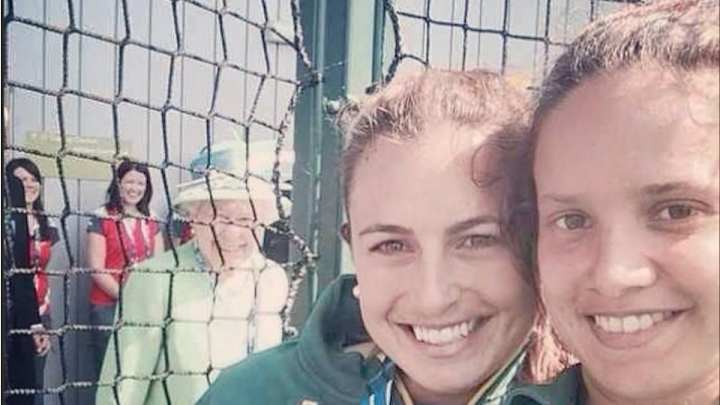 The Queen of England photobombed some field hockey players at the Commonwealth Games