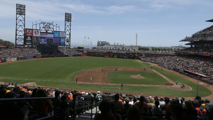 Woman knocked unconscious during fight between A's, Giants fans