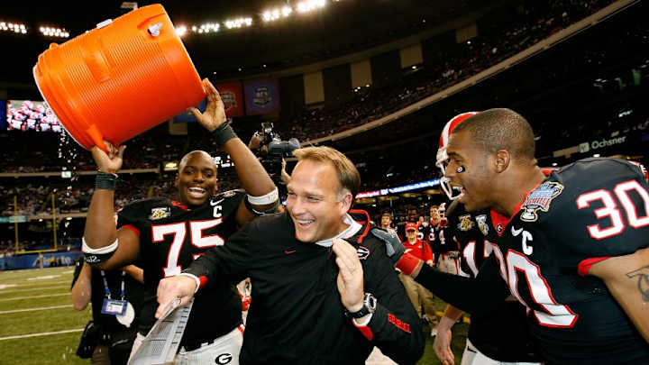 Georgia coach Mark Richt leads the Bulldogs with a backflip off a high dive Georgia coach Mark Richt leads the Bulldogs with a backflip off a high dive
