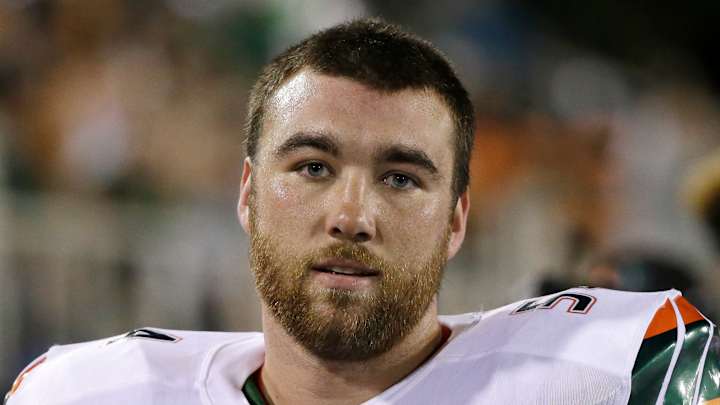 Miami OL Knighton wins Courage Award after comeback