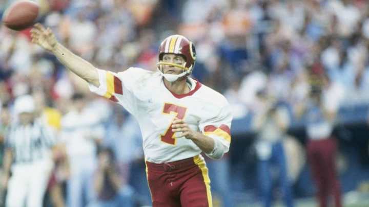Joe Theismann showed off his guns with boxer Shannon Riggs