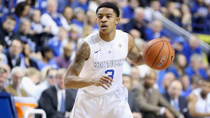 Kentucky's 5'9" Tyler Ulis stares down Auburn's 7'2" Trayvon Reed