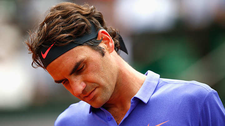 Opening Sunday at French Open dominated by Federer's scare with fan