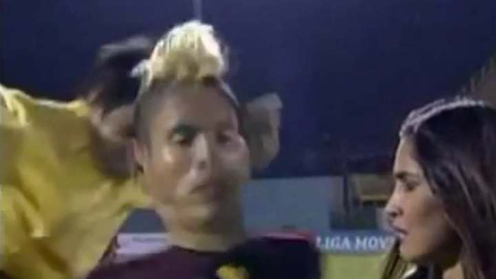 Venezuelan soccer player kicked in back during live interview