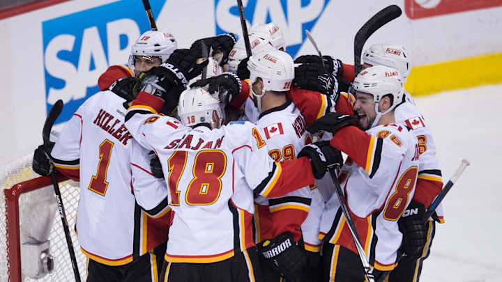 Russell scores late to lift Flames over Canucks 2-1