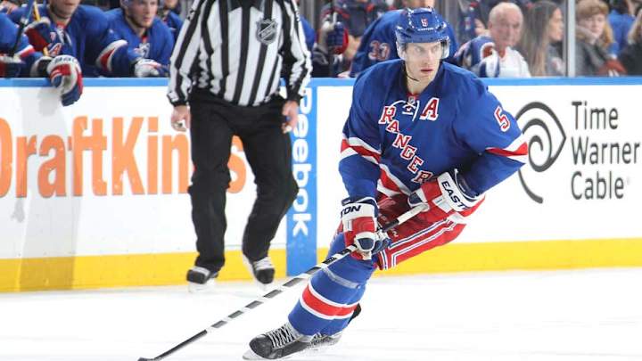 Rangers' Dan Girardi takes puck to face, does not return