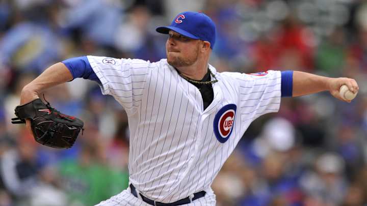 Ball stuck, Cubs' Lester tosses mitt to 1st base for out Ball stuck, Cubs' Lester tosses mitt to 1st base for out