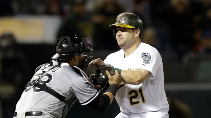 Vogt caught in rundown at plate to end A's 7-6 loss