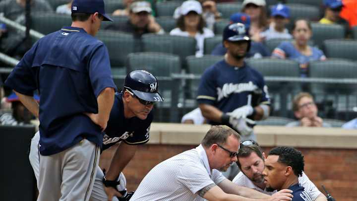 Brewers' Carlos Gomez hit in helmet by pitch, leaves game