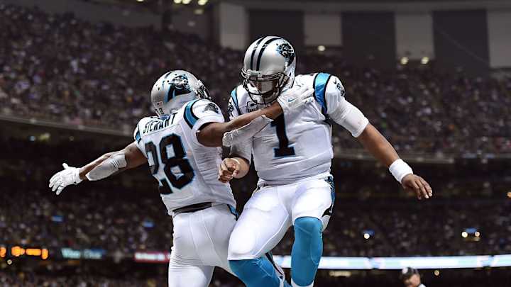 Watch: Cam Newton goes to extreme lengths to hand football to fan Watch: Cam Newton goes to extreme lengths to hand football to fan