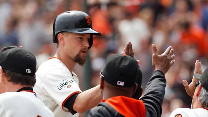 Leake pitches, hits Giants to 10-3 victory over Padres