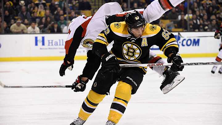 Watch: Bruins’ Brad Marchand flips Senators’ Mark Borowiecki on low hit